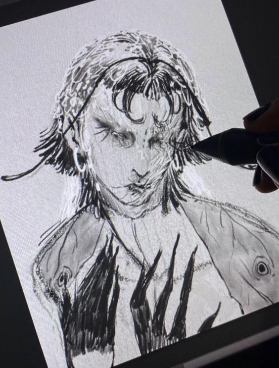 Croquis d'un visage dessiné sur tablette graphique